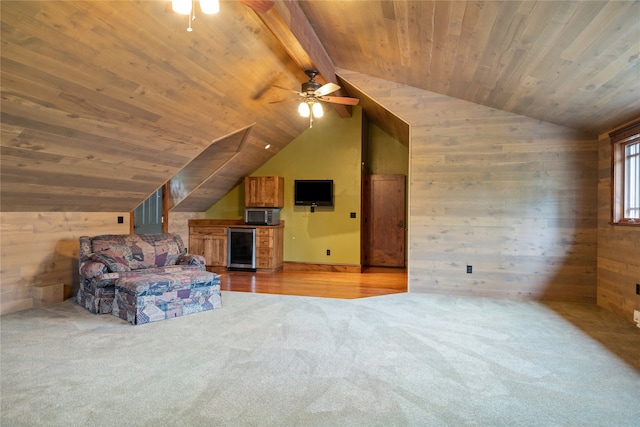 144 S Shore Pl, Seeley Lake, MT 59868 - unfurnished living room with wood walls, beverage cooler, carpet floors, ceiling fan, and wooden ceiling