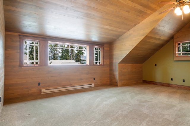 144 S Shore Pl, Seeley Lake, MT 59868 - additional living space with a baseboard heating unit, wood walls, carpet flooring, healthy amount of natural light, and wooden ceiling