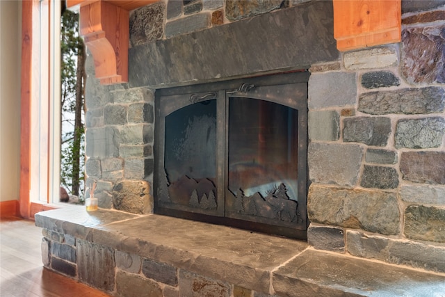 144 S Shore Pl, Seeley Lake, MT 59868 - detailed view of a stone fireplace and wood finished floors