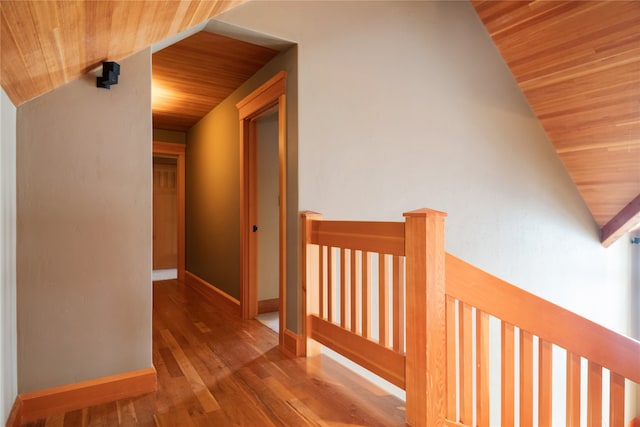 144 S Shore Pl, Seeley Lake, MT 59868 - hallway featuring wood ceiling, vaulted ceiling, an upstairs landing, and wood finished floors