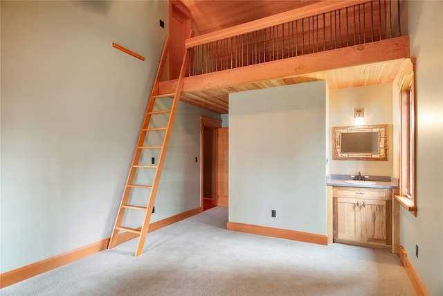 144 S Shore Pl, Seeley Lake, MT 59868 - unfurnished bedroom featuring light colored carpet and wood ceiling