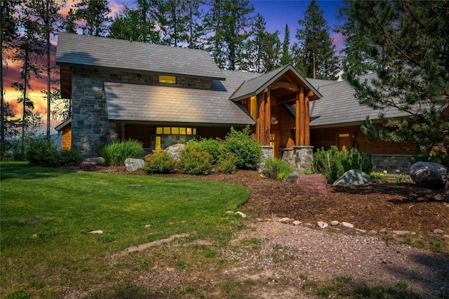 144 S Shore Pl, Seeley Lake, MT 59868 - view of front of home featuring stone siding and a front yard