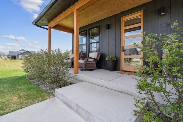 128 Owl Loop, Kalispell, MT 59901 - doorway to property with a porch and a lawn