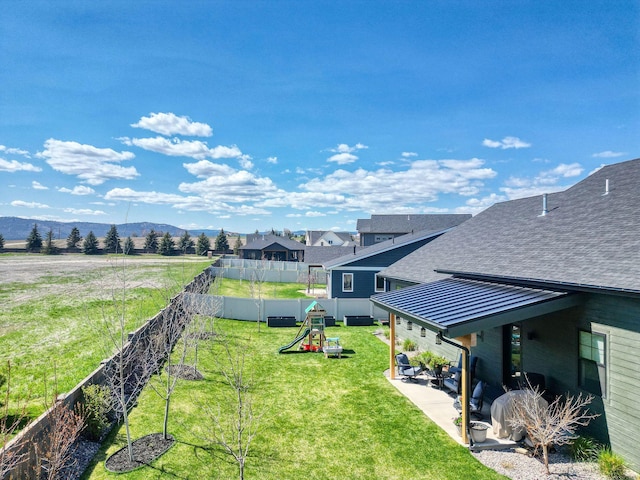 128 Owl Loop, Kalispell, MT 59901 - view of yard featuring a playground and a patio