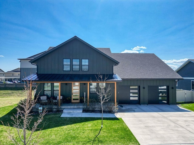 128 Owl Loop, Kalispell, MT 59901 - modern farmhouse with a porch, board and batten siding, driveway, an attached garage, and roof with shingles