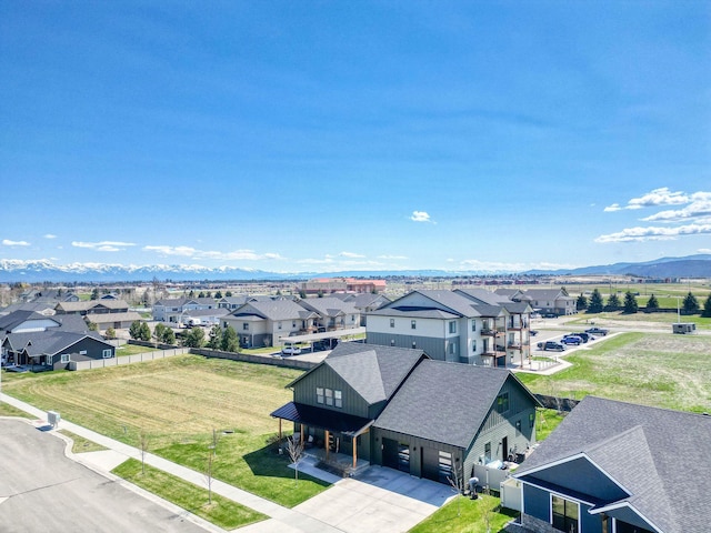 128 Owl Loop, Kalispell, MT 59901 - aerial view of residential area featuring a mountain backdrop