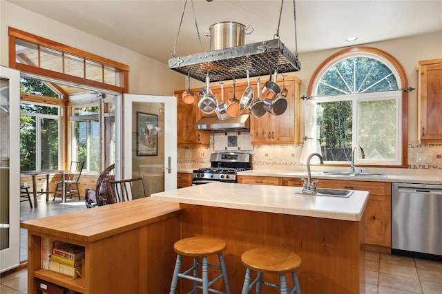 42746 Knuppel Ln, Big Arm, MT 59910 - kitchen featuring appliances with stainless steel finishes, a sink, backsplash, light tile patterned flooring, and recessed lighting