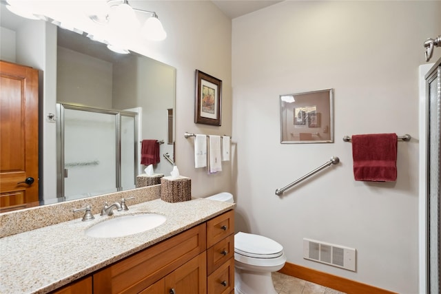 42746 Knuppel Ln, Big Arm, MT 59910 - bathroom with a stall shower, tile patterned floors, vanity, toilet, and baseboards