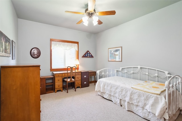 42746 Knuppel Ln, Big Arm, MT 59910 - bedroom with carpet floors, a desk, and ceiling fan