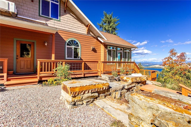 42746 Knuppel Ln, Big Arm, MT 59910 - rear view of house featuring a deck with mountain view