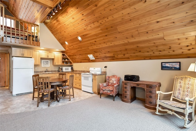 42746 Knuppel Ln, Big Arm, MT 59910 - dining area featuring wooden ceiling, vaulted ceiling, light colored carpet, and rail lighting