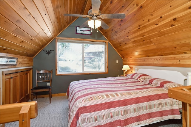 42746 Knuppel Ln, Big Arm, MT 59910 - carpeted bedroom featuring wooden ceiling, vaulted ceiling, baseboards, and wooden walls