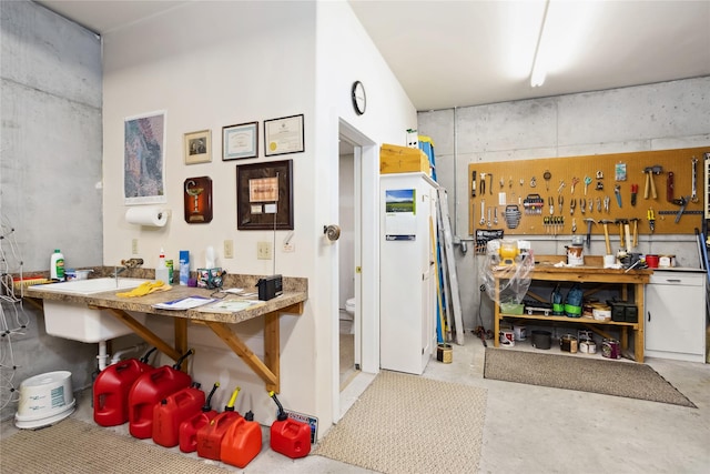 42746 Knuppel Ln, Big Arm, MT 59910 - interior space with a workshop area and concrete flooring