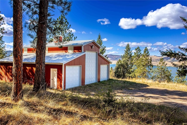 42746 Knuppel Ln, Big Arm, MT 59910 - detached garage featuring a mountain view