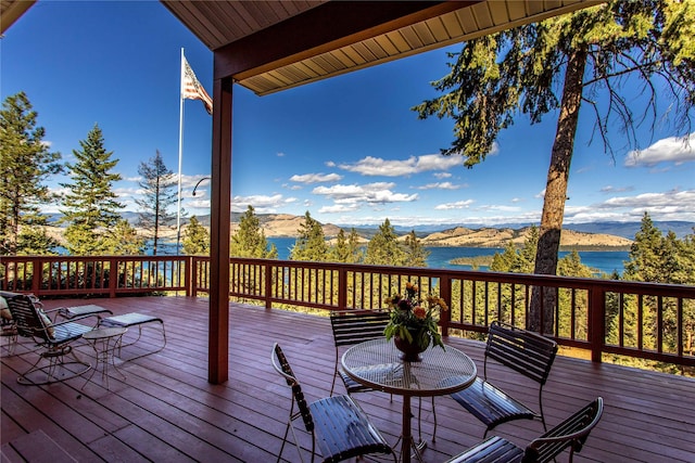 42746 Knuppel Ln, Big Arm, MT 59910 - wooden deck with a water and mountain view