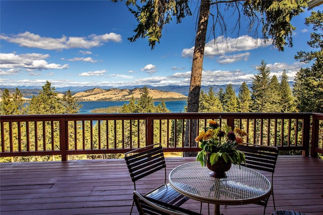 42746 Knuppel Ln, Big Arm, MT 59910 - wooden deck featuring a water and mountain view