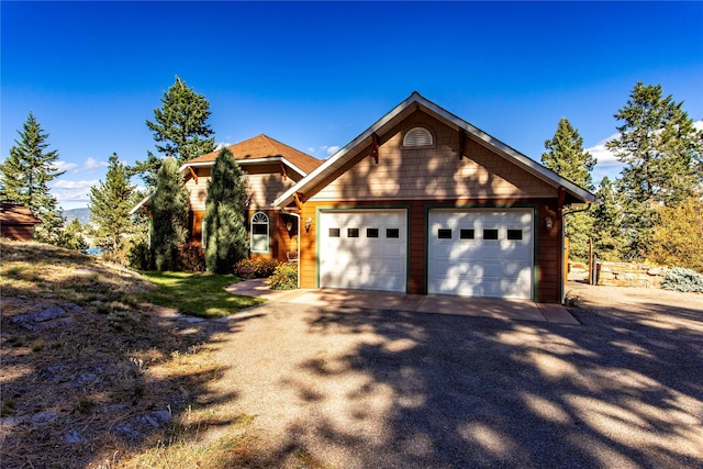 42746 Knuppel Ln, Big Arm, MT 59910 - view of front of house featuring an attached garage