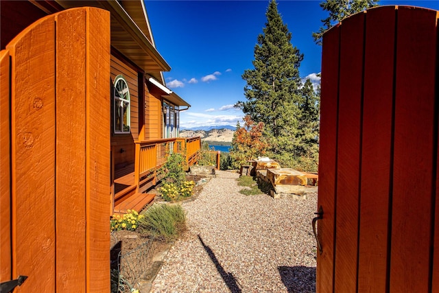 42746 Knuppel Ln, Big Arm, MT 59910 - view of yard featuring a deck with mountain view