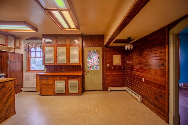 422 11th Ave, Helena, MT 59601 - interior space with light floors, ceiling fan, wooden walls, and a baseboard heating unit