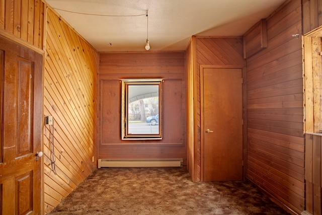 422 11th Ave, Helena, MT 59601 - hall featuring a baseboard heating unit, wood walls, and carpet