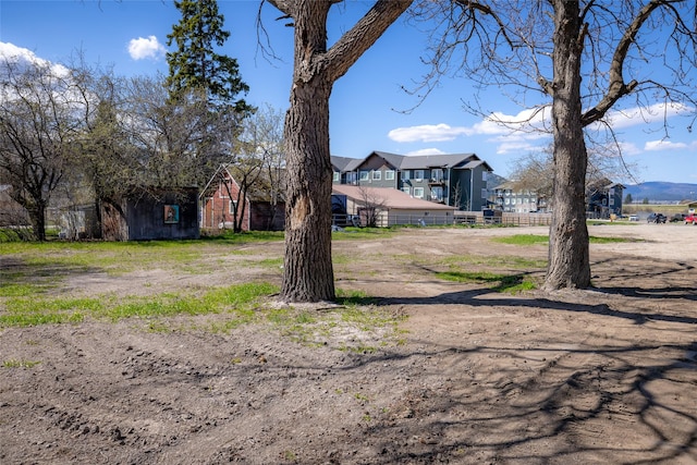 view of front of home featuring fence and a residential view