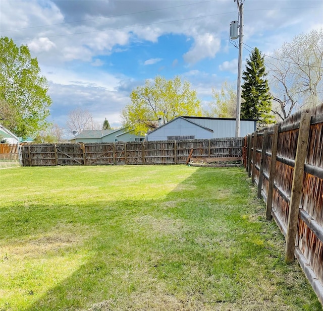 view of yard with a fenced backyard