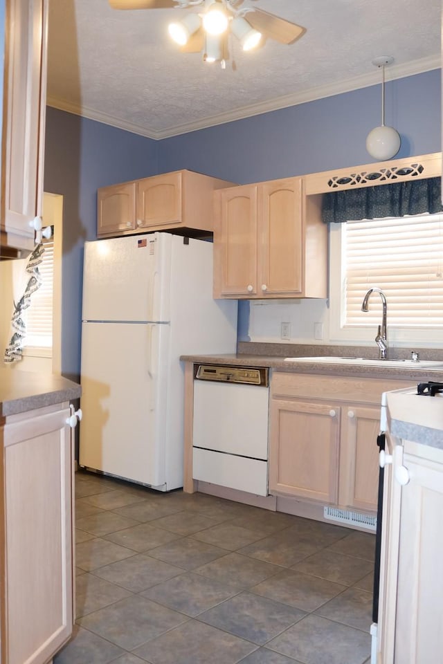 kitchen featuring a sink, white appliances, ceiling fan, crown molding, and light brown cabinets