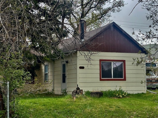 208 2nd Ave S, Belt, MT 59412 - view of property exterior with a chimney and a yard
