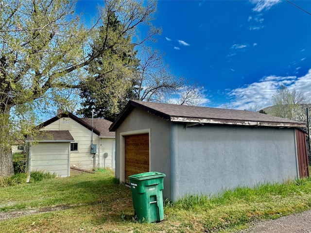 208 2nd Ave S, Belt, MT 59412 - view of home's exterior featuring a shingled roof and an outbuilding