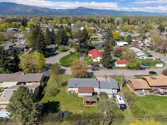 birds eye view of property with a mountain view and a residential view