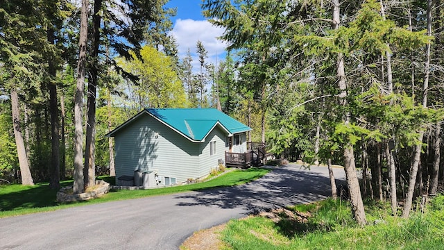 view of home's exterior with aphalt driveway