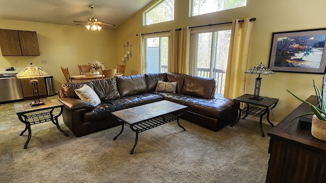 living room with light carpet, a ceiling fan, and high vaulted ceiling
