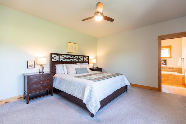 carpeted bedroom featuring baseboards and a ceiling fan