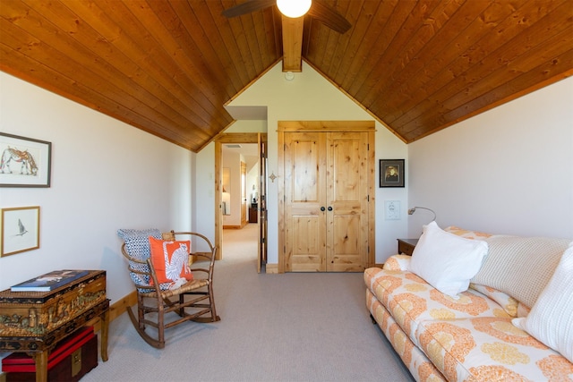 living area featuring a ceiling fan, wooden ceiling, vaulted ceiling with beams, and carpet floors