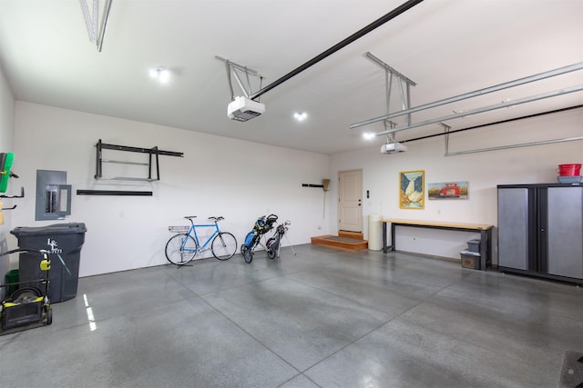 garage with electric panel and a garage door opener
