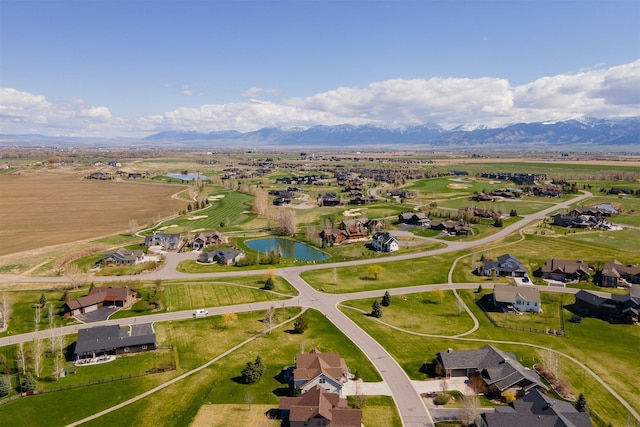 bird's eye view featuring a residential view and a water and mountain view