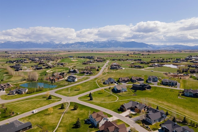 aerial view featuring a water and mountain view and a residential view