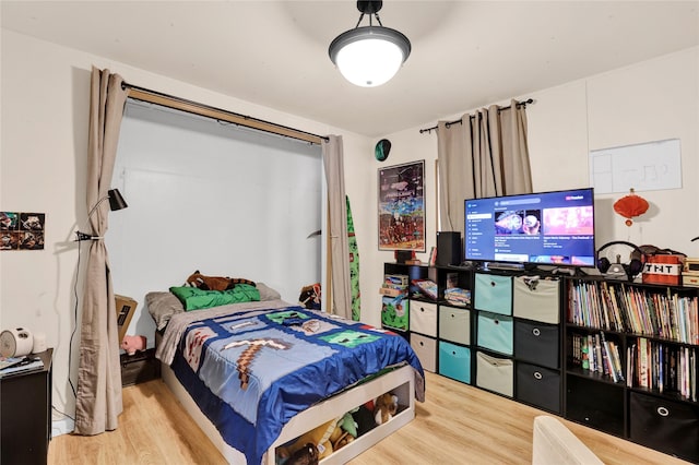 bedroom featuring wood finished floors