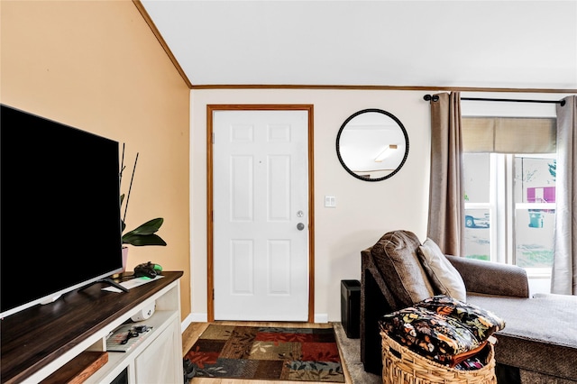 entrance foyer featuring crown molding, plenty of natural light, and baseboards