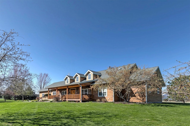 406 Back Nine Ln, Hamilton, MT 59840 - cape cod-style house featuring a porch and a front yard