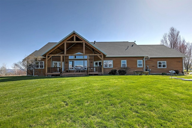 406 Back Nine Ln, Hamilton, MT 59840 - back of property with roof with shingles, a deck, and a lawn