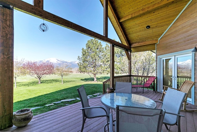 406 Back Nine Ln, Hamilton, MT 59840 - wooden deck featuring a lawn, outdoor dining area, and a mountain view