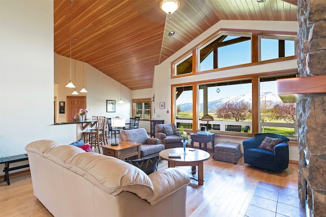 406 Back Nine Ln, Hamilton, MT 59840 - living area with high vaulted ceiling, wooden ceiling, and hardwood / wood-style flooring