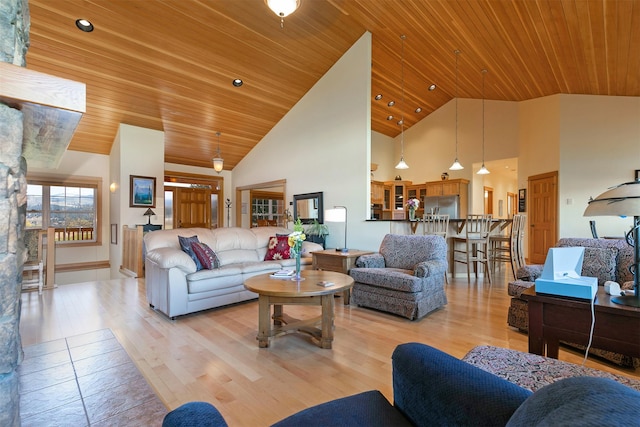 406 Back Nine Ln, Hamilton, MT 59840 - living room featuring light wood-style flooring, high vaulted ceiling, and wood ceiling