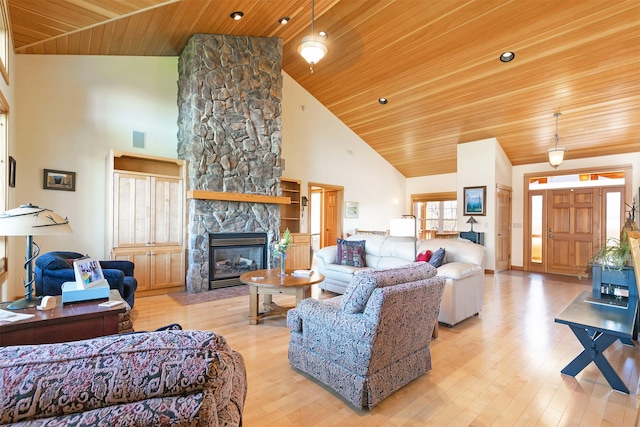 406 Back Nine Ln, Hamilton, MT 59840 - living area featuring light wood-type flooring, high vaulted ceiling, visible vents, wooden ceiling, and a fireplace