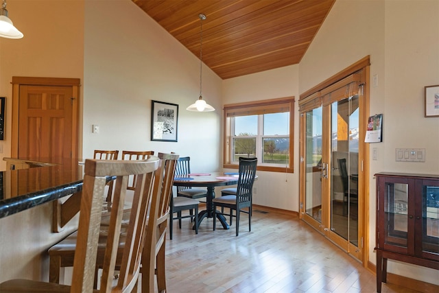 406 Back Nine Ln, Hamilton, MT 59840 - dining space with lofted ceiling, french doors, light wood-type flooring, wooden ceiling, and baseboards