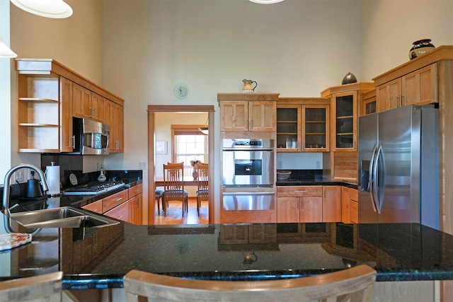 406 Back Nine Ln, Hamilton, MT 59840 - kitchen with a sink, open shelves, a towering ceiling, a warming drawer, and stainless steel appliances