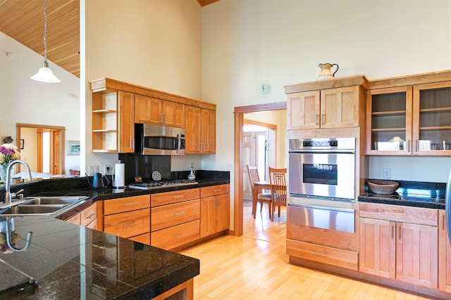 406 Back Nine Ln, Hamilton, MT 59840 - kitchen with tile countertops, a sink, high vaulted ceiling, a warming drawer, and appliances with stainless steel finishes