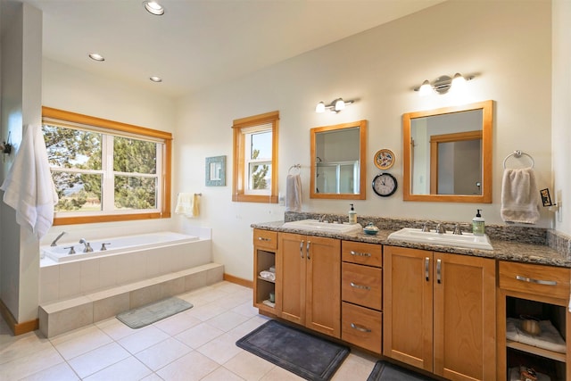 406 Back Nine Ln, Hamilton, MT 59840 - bathroom featuring a sink, double vanity, a bath, and tile patterned floors