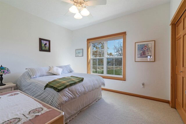 406 Back Nine Ln, Hamilton, MT 59840 - bedroom featuring baseboards, a ceiling fan, and light colored carpet
